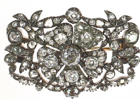 Appraisal: A Georgian diamond brooch of flowerhead form within a pierced