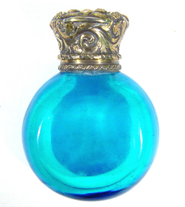 Appraisal: Blue glass globular scent bottle with unmarked embossed metal mount