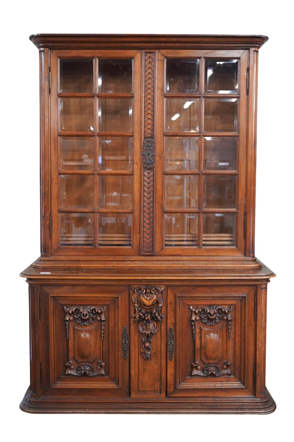 Appraisal: BAROQUE STYLE CARVED WALNUT CABINETconstructed in two sections the upper