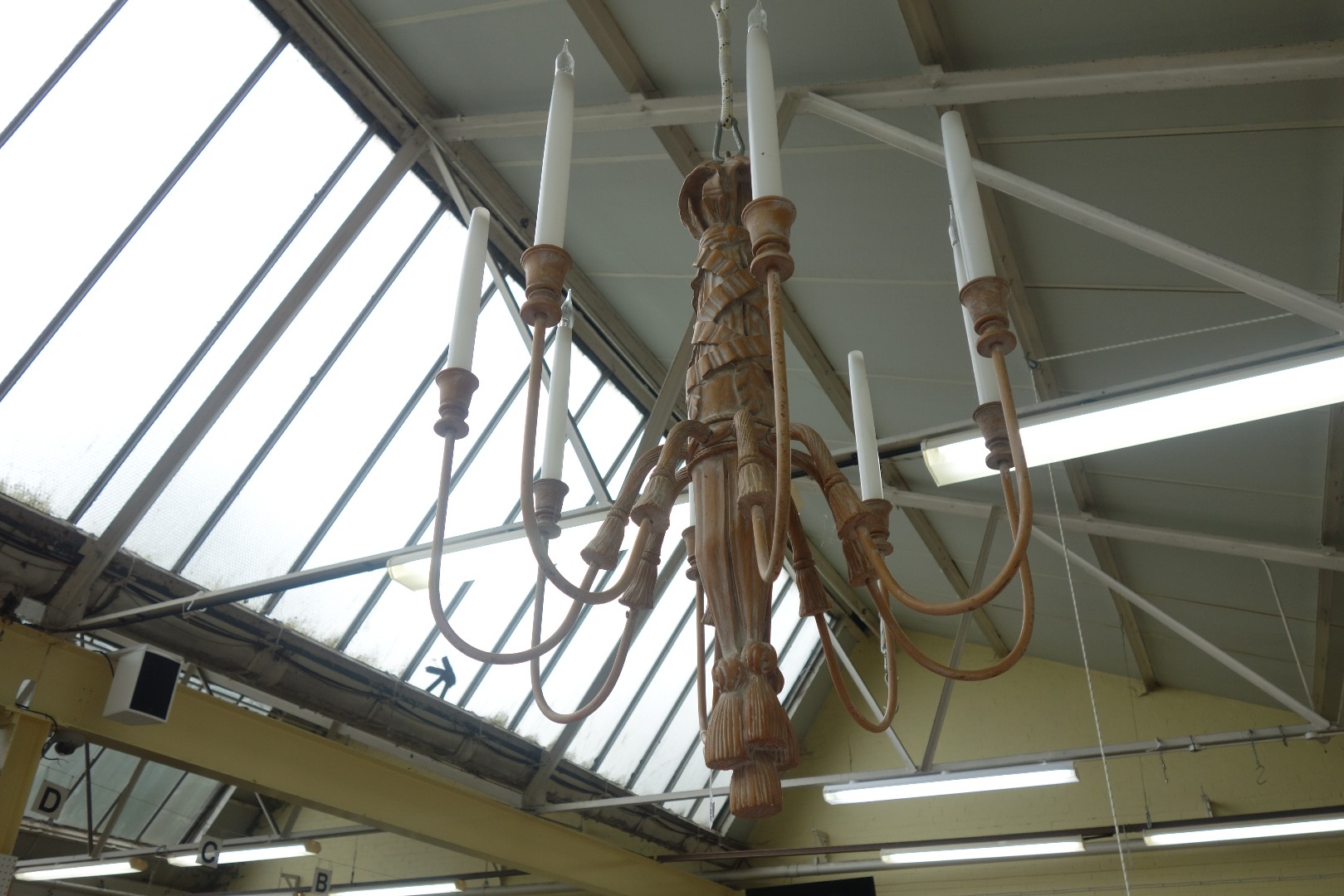 Appraisal: A modern eight branch carved wooden chandelier the central swag