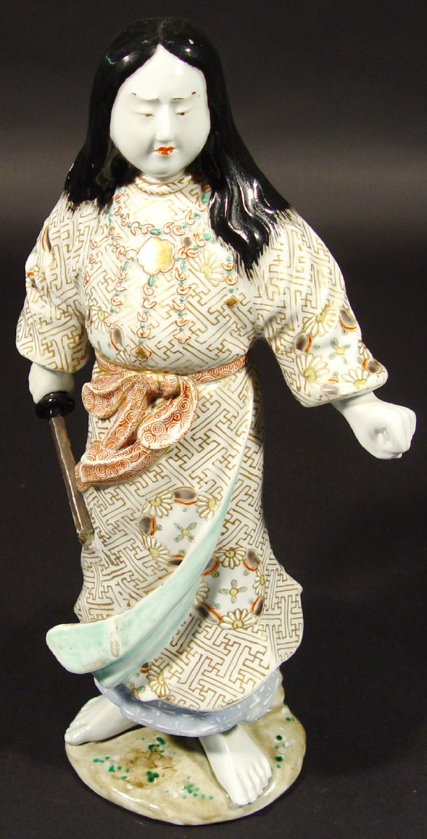 Appraisal: Oriental porcelain warrior clutching a sword with hand painted and