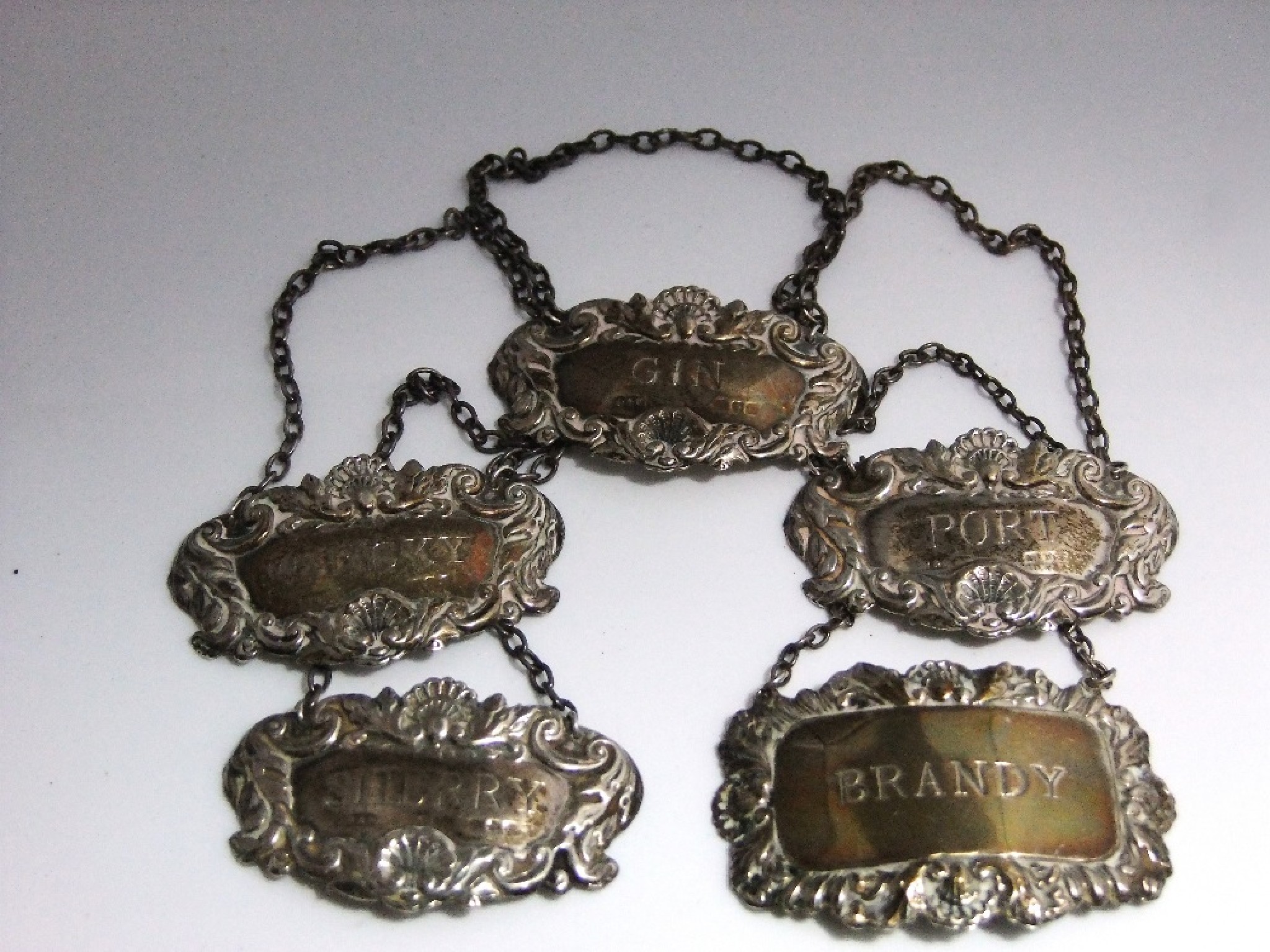 Appraisal: Five silver decanter labels Gin Whisky Brandy Sherry and Port