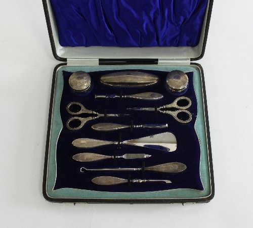 Appraisal: A cased silver mounted manicure set DM Co Birmingham comprising