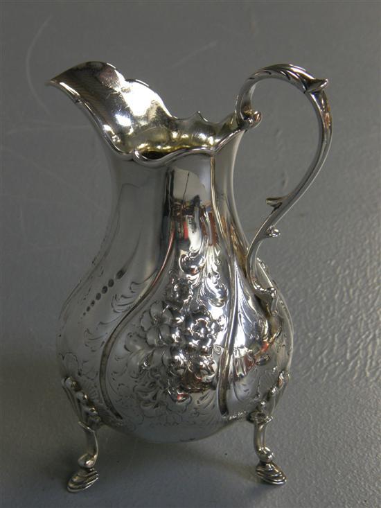 Appraisal: Victorian silver water jug with shaped spout and scrolling handle