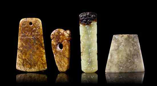 Appraisal: A Group of Four Archaistic Jade Articles comprising one pommel