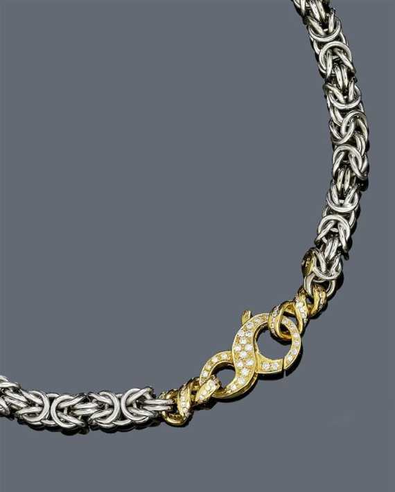 Appraisal: GOLD AND DIAMOND NECKLACE White and yellow gold Casual-elegant solid