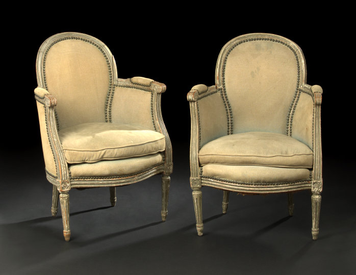 Appraisal: Pair of Louis XVI-Style Carved and Cream-Painted Beechwood Bergeres early