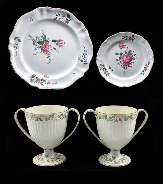 Appraisal: A pair of Wedgwood creamware urns together with four faience