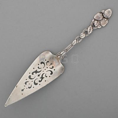 Appraisal: TIFFANY CO SILVER PIE SERVER th C Ornamental strawberry handle