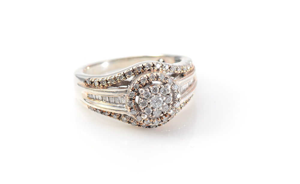 Appraisal: PLATINAIRE DIAMOND RING A melee of round single cut and