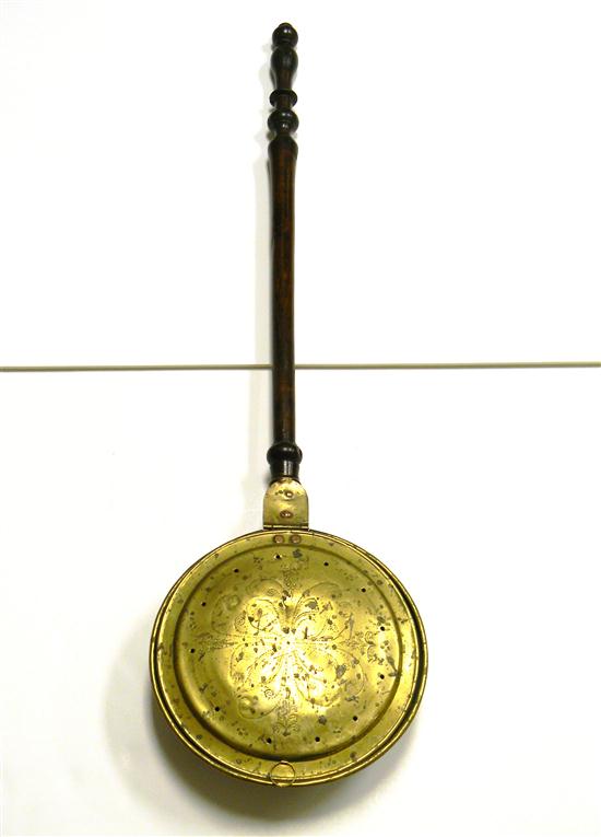 Appraisal: Brass bed warmer with wooden handle flower decoration some dents