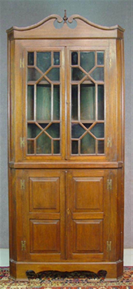 Appraisal: Walnut Corner Cupboard Circa Gooseneck pediment over tow -light astragal