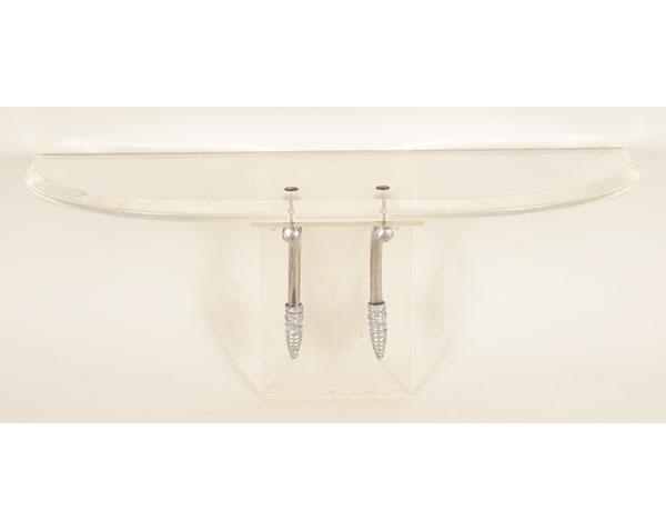 Appraisal: Deco style lucite chrome wall shelf with curved metal brace