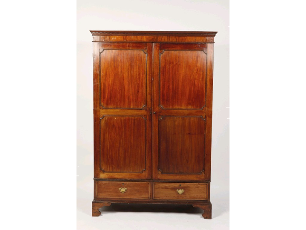 Appraisal: A GEORGE III MAHOGANY WARDROBE the rectangular cornice with dentiled