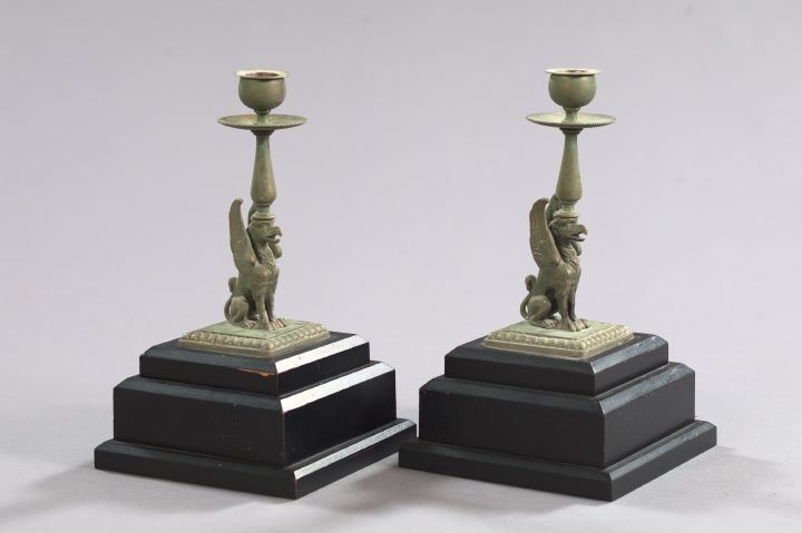 Appraisal: Pair of Napoleon III-Style Bronze Patinated Griffin-Form Candlesticks each depicting