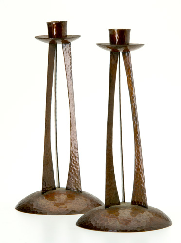 Appraisal: ROYCROFT Pair of rare hammered copper candlesticks with three curved