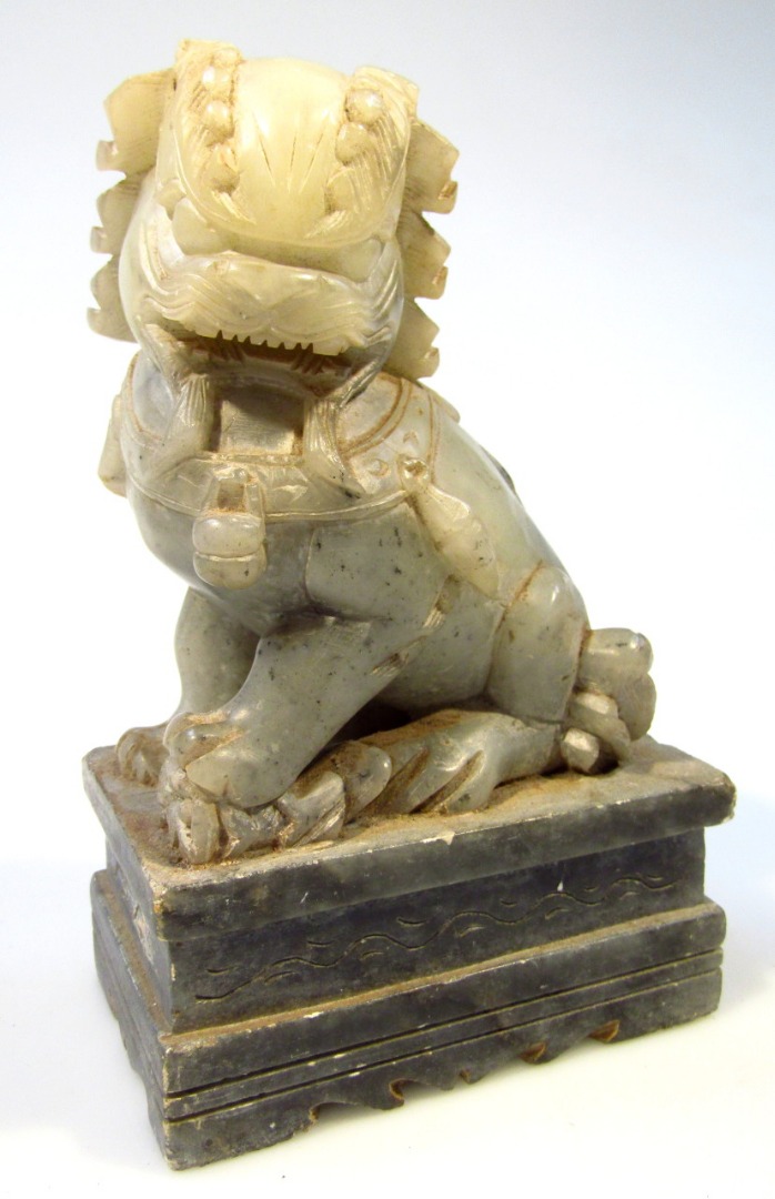 Appraisal: A Chinese soap stone Dog of Fo on elaborate base