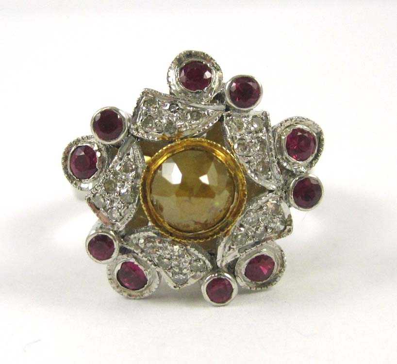 Appraisal: DIAMOND RUBY SILVER AND YELLOW GOLD RING The sterling silver