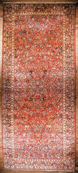 Appraisal: A Large Semi-Antique Persian Carpet red ground overall floral motifs