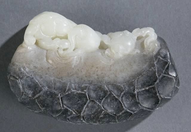 Appraisal: Chinese carved jade of rabbits on a rock A Chinese