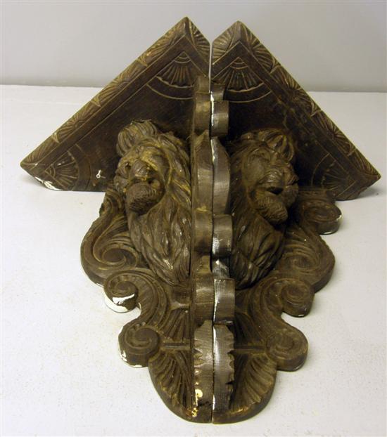 Appraisal: Pair of oak carved corner wall brackets carved with lions'