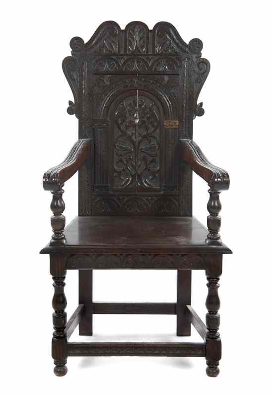 Appraisal: A Renaissance Revival Open Armchair having a carved panel back