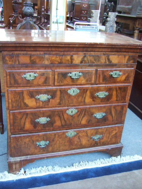 Appraisal: A Queen Anne figured walnut chest of drawers the moulded