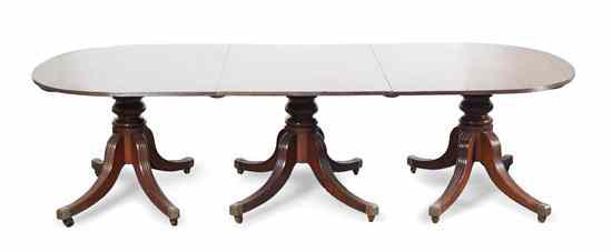 Appraisal: A Georgian Style Mahogany Triple Pedestal Dining Table having an