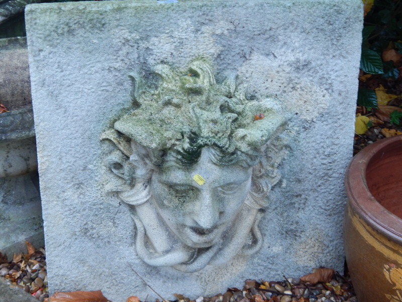 Appraisal: A composition garden plaque moulded with the head of Medusa