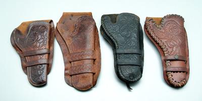 Appraisal: Four Colt revolver holsters all tooled leather for single-action guns