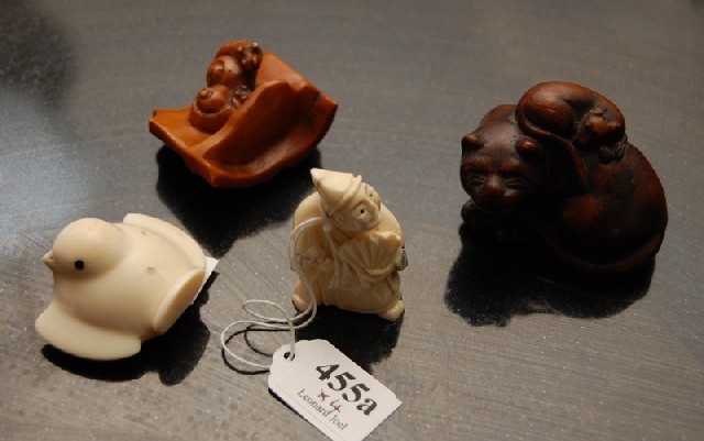 Appraisal: A COLLECTION OF JAPANESE IVORY AND BOXWOOD NETSUKE Comprising three