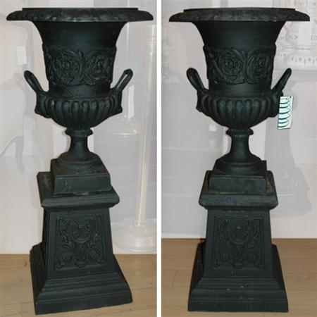 Appraisal: Pair of Neoclassical Style Painted Iron Urns on Pedestals Estimate