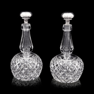 Appraisal: A Pair of American Cut Glass Decanters with Silver Stoppers