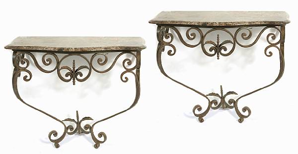 Appraisal: A pair of wrought iron and granite console tables height