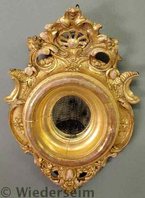 Appraisal: Diminutive oval Continental mirror th c with a pierced crest