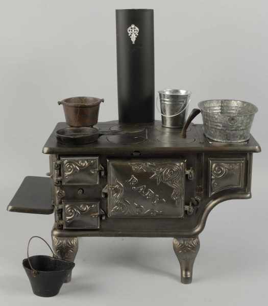 Appraisal: Cast Iron Ideal Baby Children's Stove Description Includes stovepipe all