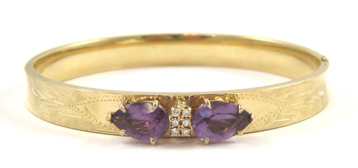 Appraisal: DIAMOND AND AMETHYST BANGLE The k yellow gold hinged bangle