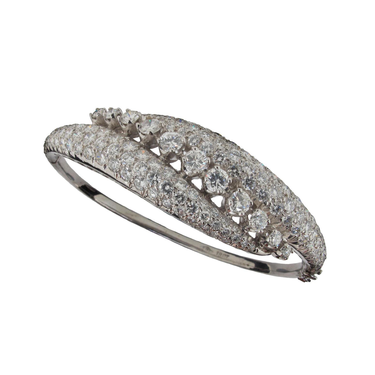 Appraisal: A diamond set hinged bangle