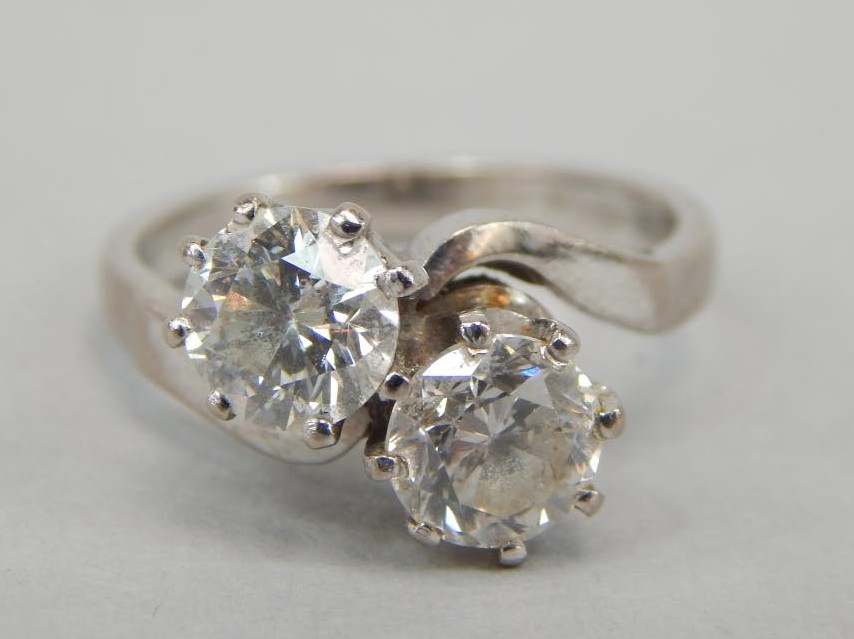 Appraisal: A twist ring set with two diamonds of approximately ct