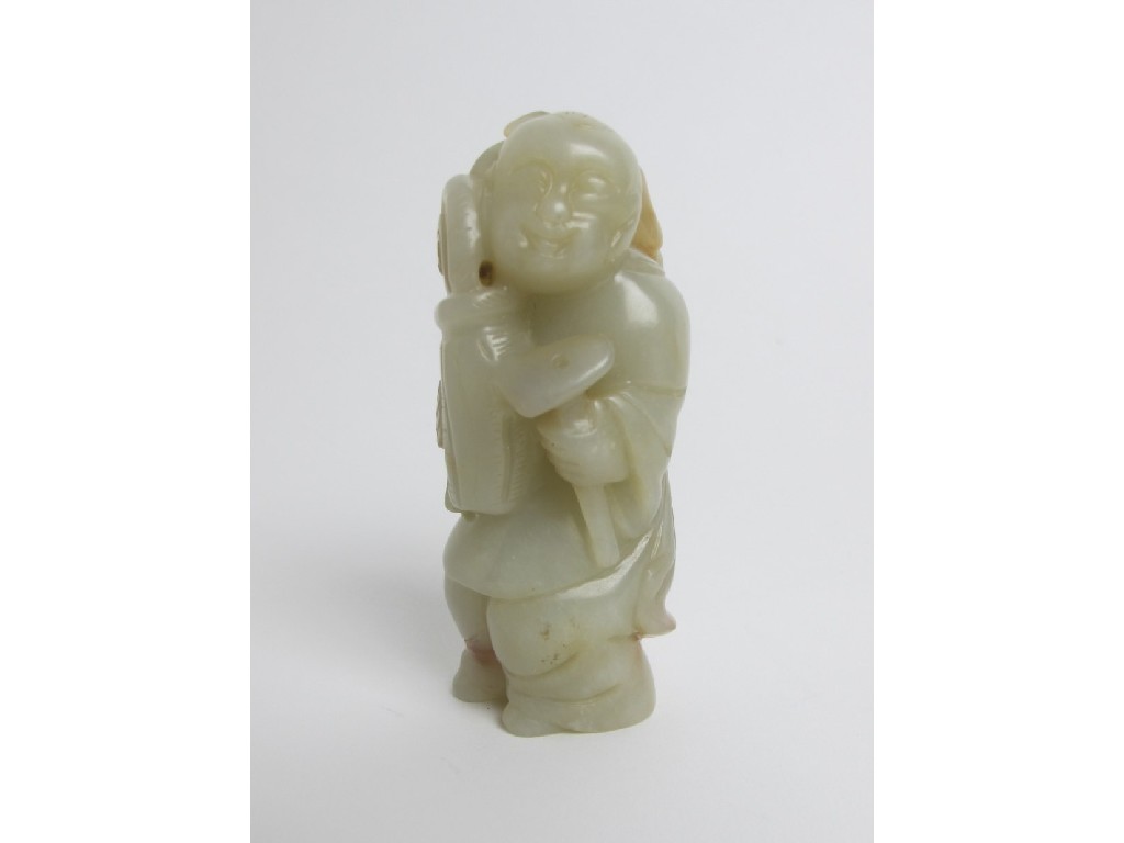 Appraisal: A Chinese jade carving of a boy holding a vase