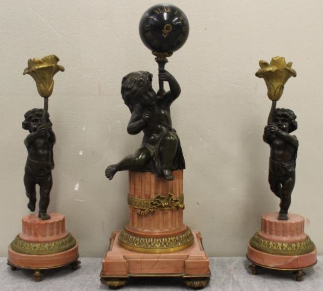 Appraisal: Patinated Bronze Rouge Marble Putti Form ClockGarniture Set From a