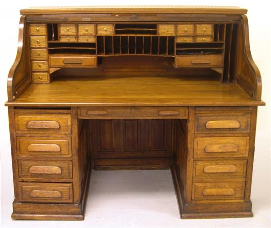 Appraisal: Early th-century oak S-scroll roll top pedestal desk T G