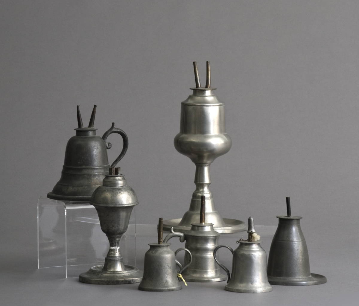 Appraisal: SEVEN PEWTER WHALE OIL LAMPS INCLUDING ONE STAMPED quot MOREY