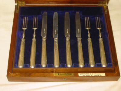 Appraisal: A SET OF EIGHT DESSERT KNIVES AND FORKS with reeded