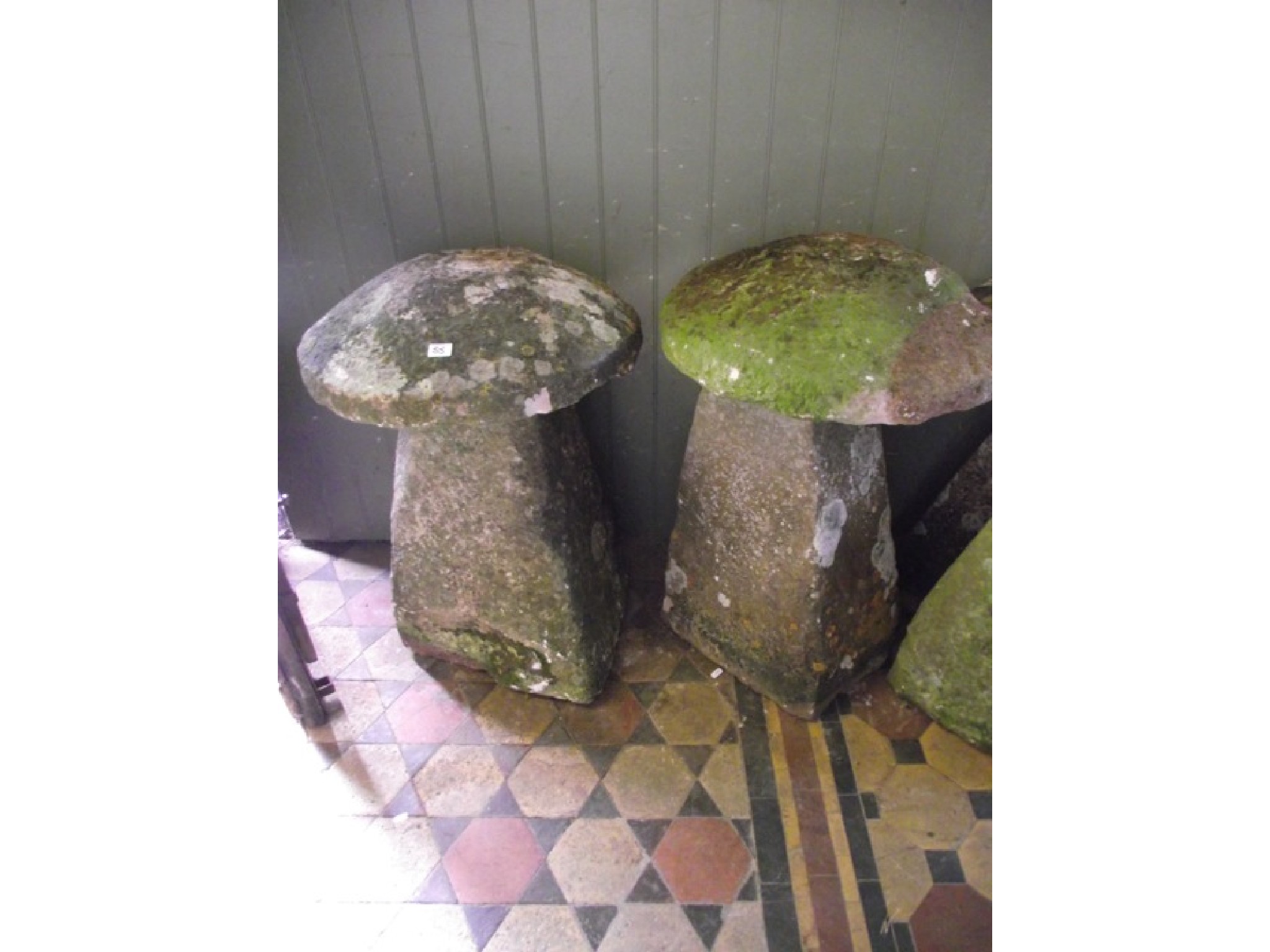 Appraisal: Two similar natural stone staddle stones with tapered bases beneath