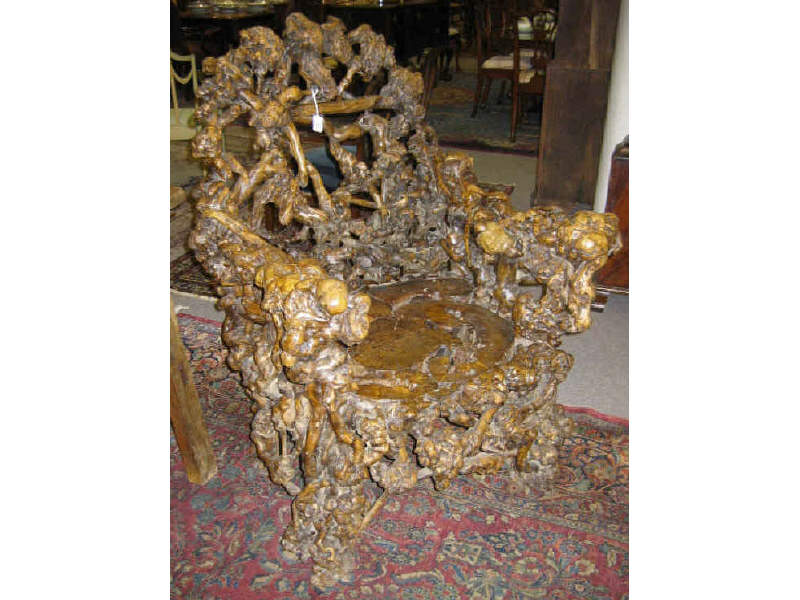 Appraisal: CHINESE ELM ROOT ARMCHAIR Large typical chair form made of