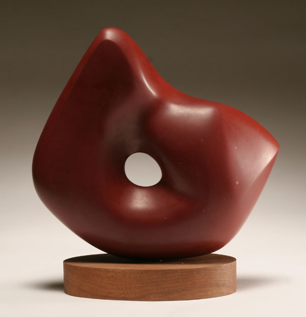 Appraisal: Modern abstract amorphic polished red stone sculpture mounted on wooden