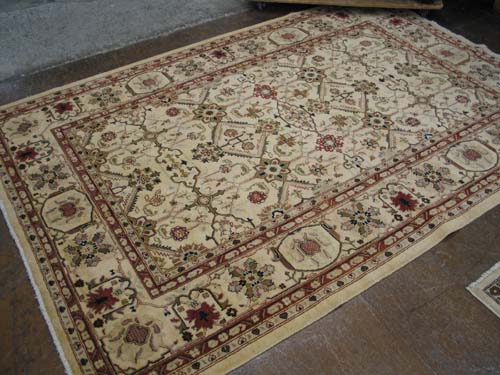 Appraisal: HAND KNOTTED ORIENTAL CARPET overall stylized floral design on chamois