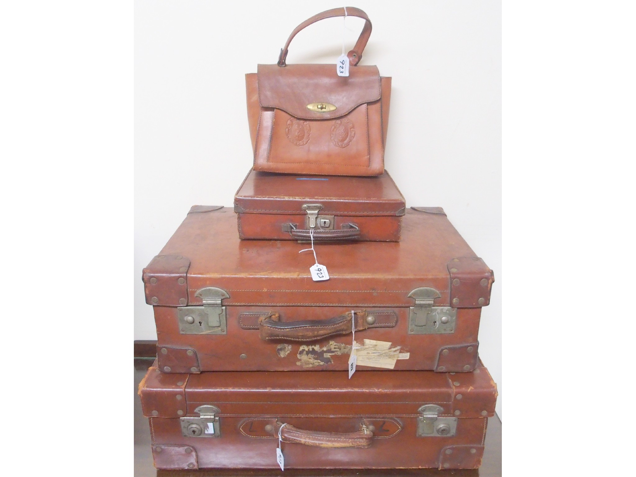 Appraisal: Two leather suitcases handbag and attach case