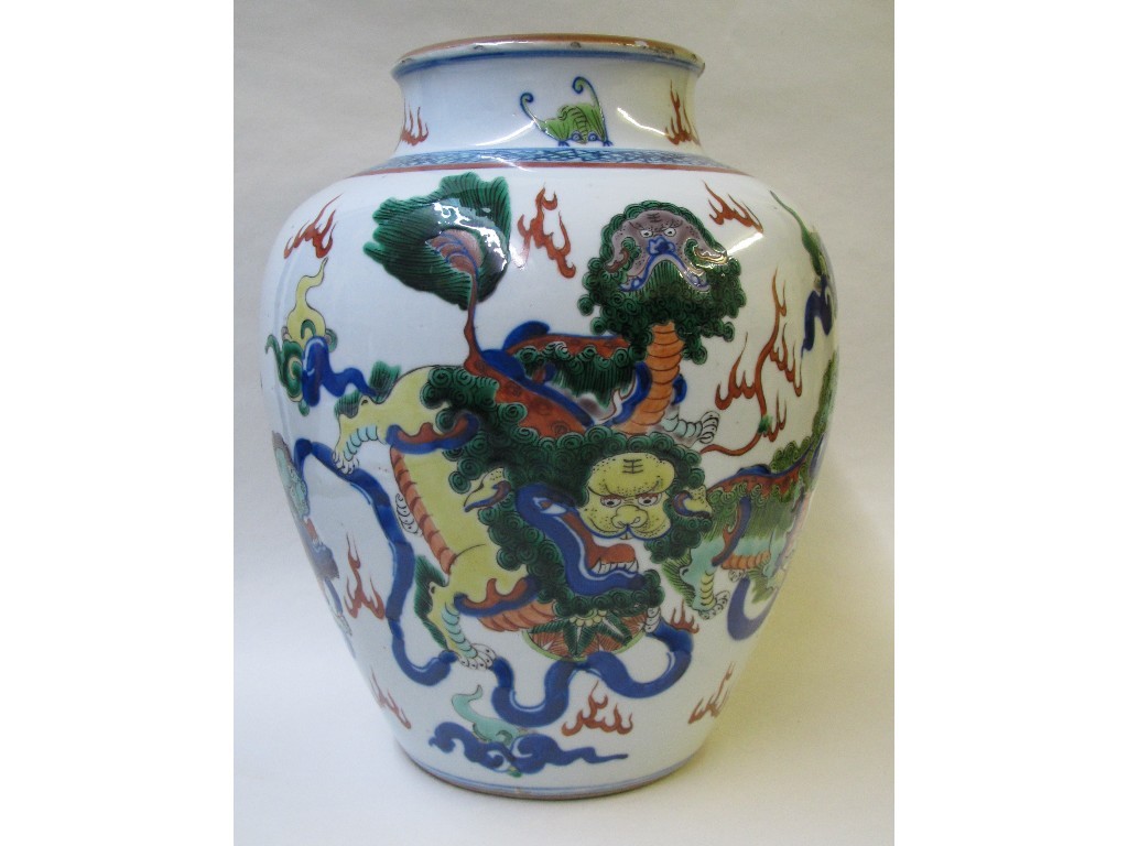 Appraisal: A Wucai baluster vase painted with buddhistic lions amongst clouds